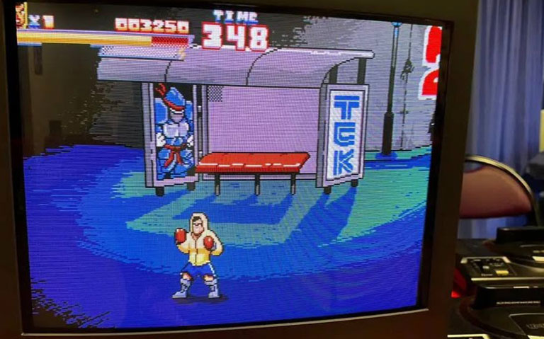 Kirito the Game qui tourne sur un écran CRT près d'une Mega Drive